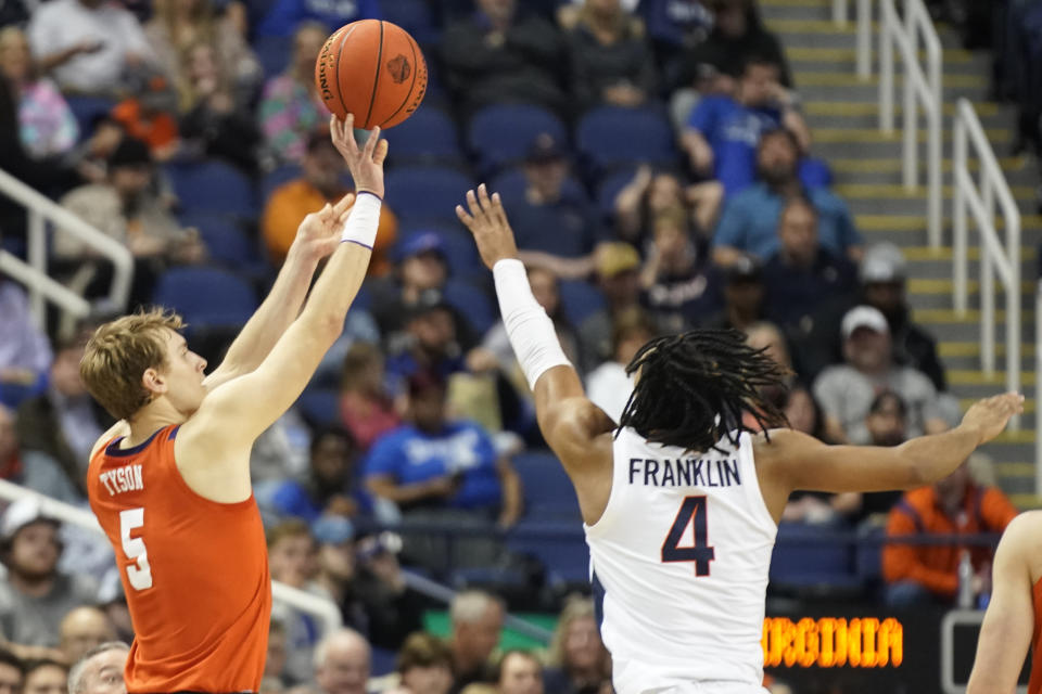 Clemson forward Hunter Tyson (5) shoots against Virginia guard Armaan Franklin (4) during the first half of an NCAA college basketball game at the Atlantic Coast Conference Tournament in Greensboro, N.C., Friday, March 10, 2023. (AP Photo/Chuck Burton)