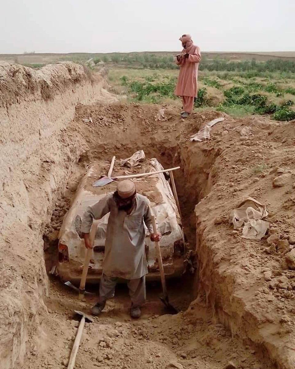 The car was buried beside the mud wall of a traditional village in Afghanistan’s southern Zabul province. (Mjalal313 / Twitter)