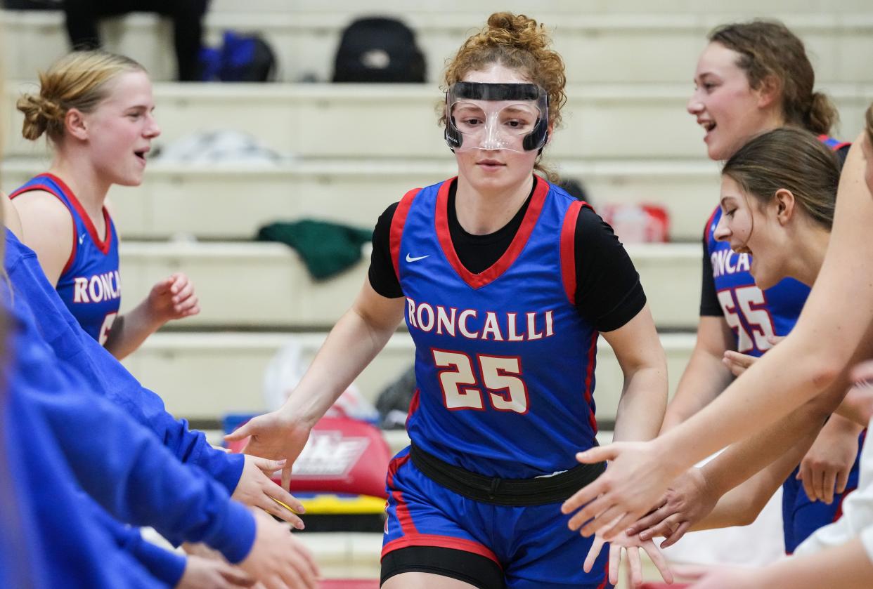 Roncalli Royals guard Elliot Leffler (25) runs out to the court during team introductions Tuesday, Nov. 14, 2023, during the game at Pike High School in Indianapolis.