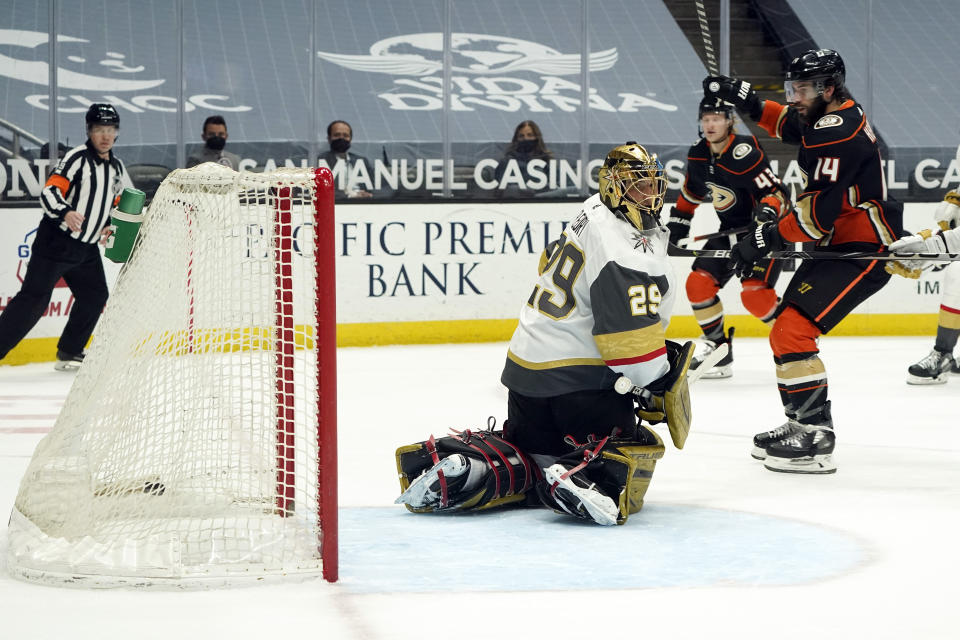 Anaheim Ducks center Adam Henrique (14) celebrates after assisting on a goal from Danton Heinen (not shown) past Vegas Golden Knights goaltender Marc-Andre Fleury (29) during the second period of an NHL hockey game Sunday, April 18, 2021, in Anaheim, Calif. (AP Photo/Marcio Jose Sanchez)