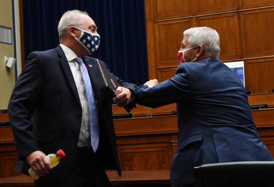 Rep. Steve Scalise (R-La.), left, elbow-bumps Anthony Fauci, director of the National Institute for Allergy and Infectious Diseases, after a House Subcommittee on the Coronavirus Crisis hearing on Capitol Hill in Washington, D.C., on July 31. (Photo: KEVIN DIETSCH via Getty Images)