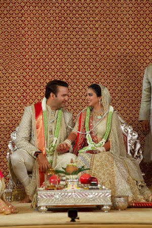 Bride Isha Ambani, the daughter of the Chairman of Reliance Industries Mukesh Ambani, and her groom Anand Piramal, heir to a real-estate and pharmaceutical business, after they got married in Mumbai, December 12, 2018. Reliance Industries/Handout via REUTERS/Files