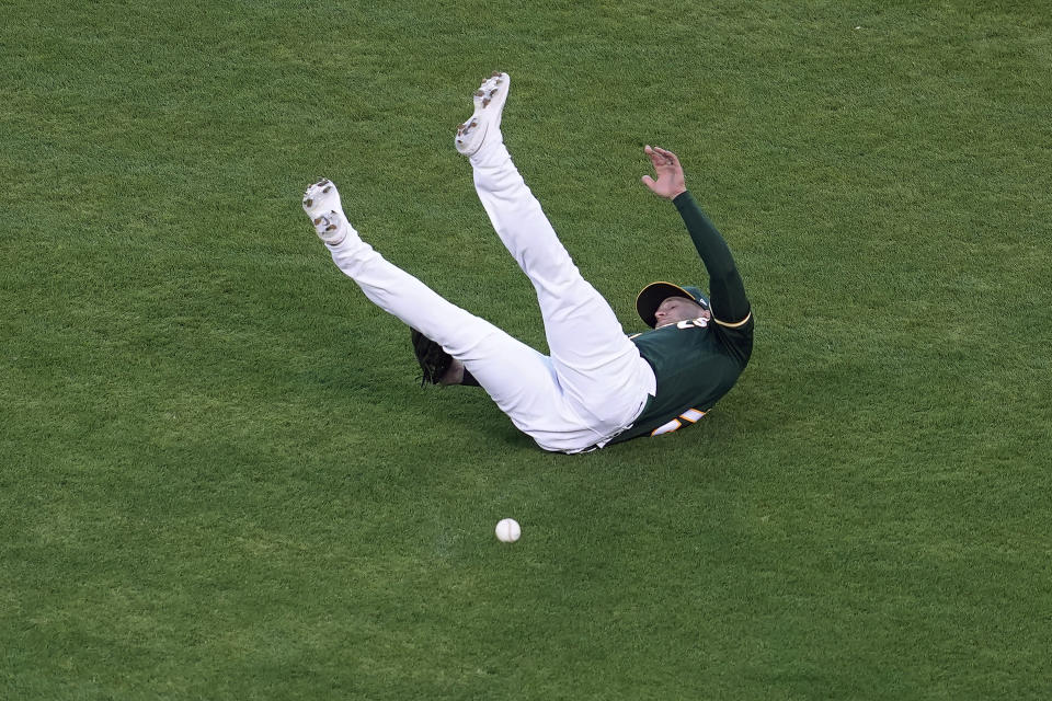 Oakland Athletics' Seth Brown cannot catch a single by Kansas City Royals' Jorge Soler during the seventh inning of a baseball game in Oakland, Calif., Friday, June 11, 2021. (AP Photo/Jeff Chiu)