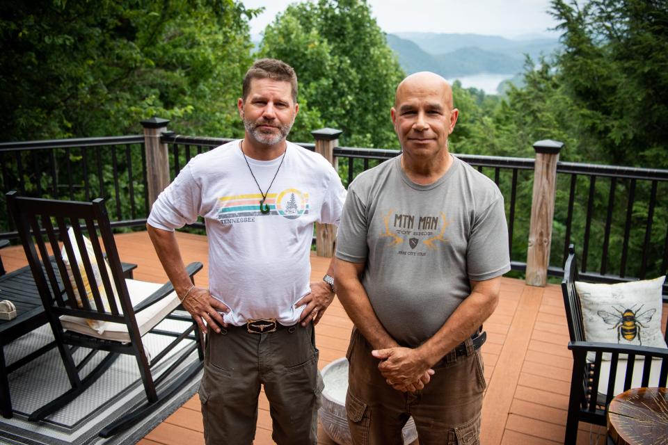 Lone Mountain Shores residents Mike Sislow, left, and Paul Schmutzler, right, are photographed at Schmutzler's home in the New Tazewell community on Wednesday, July 26, 2023.