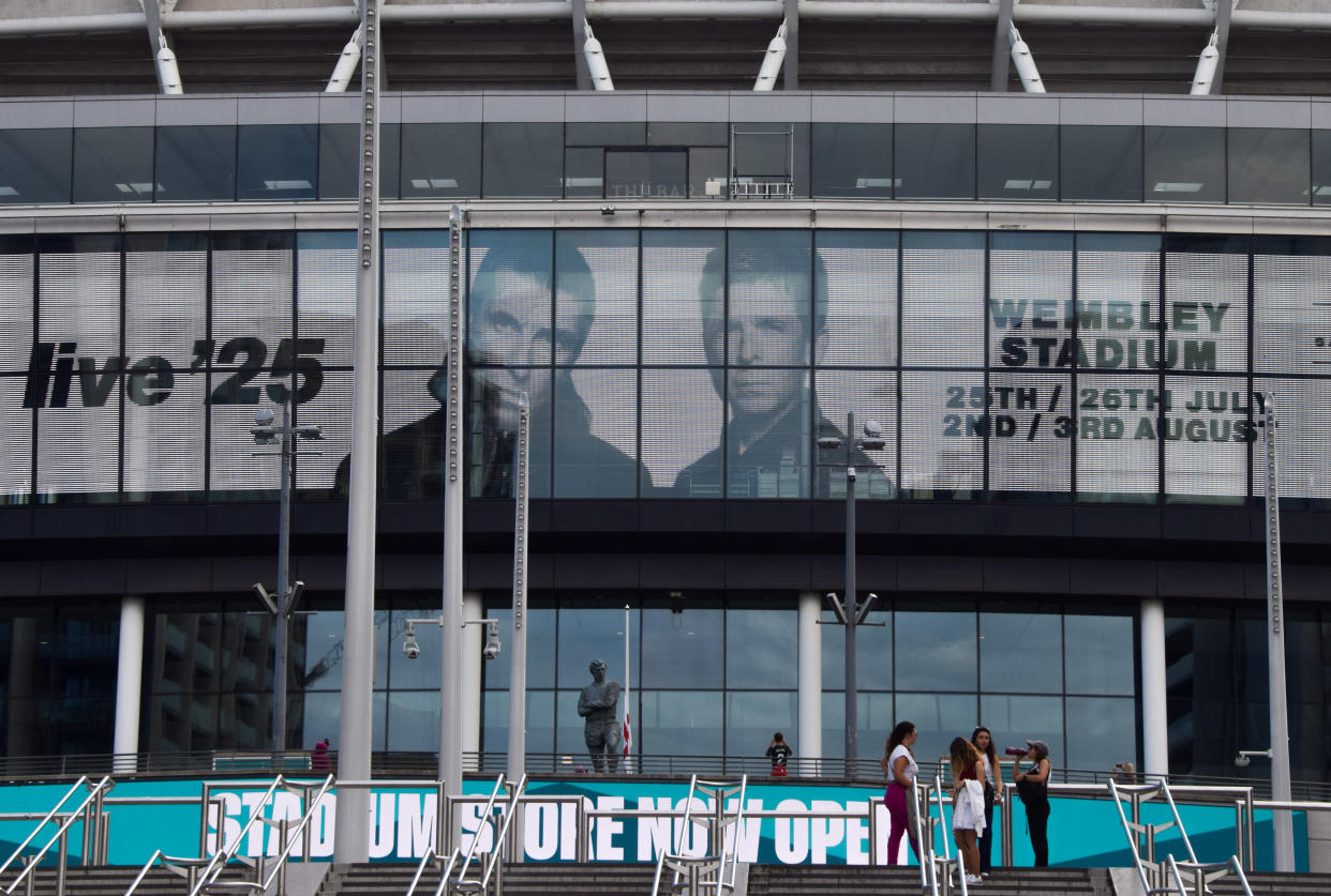 Screens at Wembley Stadium advertise the forthcoming gigs by Oasis. (Getty)