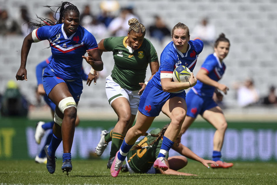 Romane Menager of France runs at the defense during the Women's Rugby World Cup pool match between South Africa and France, at Eden Park, Auckland, New Zealand, Saturday, Oct.8. 2022. (Andrew Cornaga/Photosport via AP)