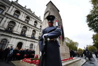 <p>People observe two minutes silence during a service at the Cenotaph to mark Armistice Day in London, Britain, Nov. 11, 2017. (Photo: Andy Rain/EPA-EFE/REX/Shutterstock) </p>