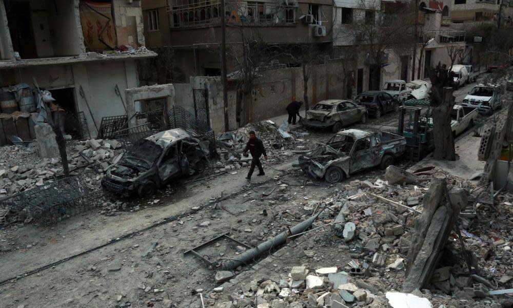 Damaged buildings in eastern Ghouta on Sunday following regime air strikes.