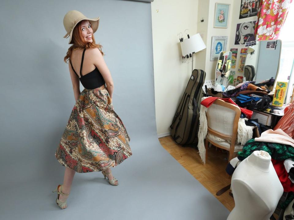 Woman models vintage clothing from Etsy store