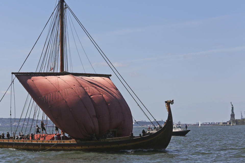 <p>The crew of the Norwegian Viking ship, Draken Harald Haarfagre, lowers it’s sail as is sails past the Statue of Liberty in New York harbor, Sept. 17, 2016, in New York. (Photo: Mary Altaffer/AP) </p>