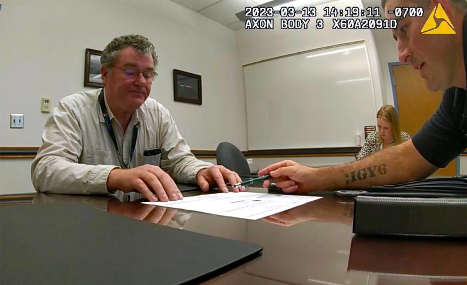 Former Kennewick Mayor Bill McKay talks about local massage parlors with Kennewick Detectives Elizabeth Grant, middle, and Kris Safranek during a March 13, 2023 interview at the Kennewick police station.