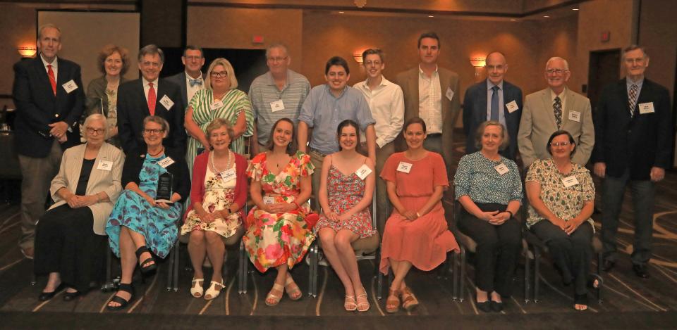 The late Sam D. Kennedy, former The Daily Herald Columbia publisher and president of Kennedy Newspapers, was inducted into the Tennessee Newspaper Hall of Fame at the Tennessee Press Association’s summer meeting last week in Franklin. A crowd of family, friends, colleagues and former staff gathered to honor Kennedy. (Back row, left to right) former publisher of the Daily Herald Keith Ponder; former Herald reporter Sue McClure, son-in-law Billy Blackstone; former Kennedy Newspaper/Lawrence County Advocate General Manager John Finney; Sandy Finney; former Advocate Editor Joe Baxter; grandsons Emory Blackstone, Jack Blackstone, and Sam Kennedy III; former Herald Editor Tony Kessler; Richard Schilling; and Glen Stewart. In the front row are former Herald General Manager Betty Stewart; Sam D. Kennedy's daughter Elizabeth Kennedy Blackstone (holding award); cousin Jan Finney Schilling; granddaughter Eliza Blackstone; Emily O’Connell; granddaughter-in-law Rachel Kennedy, former Advocate editor Nancy Brewer, and Advocate Editor LaShawn Baxter.