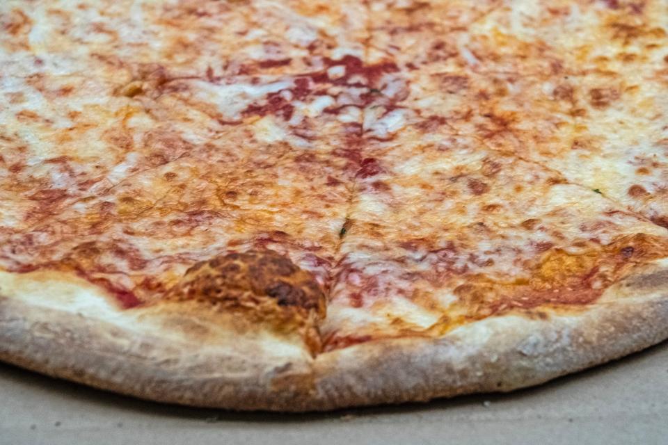 A close-up of finalist Margherita's Pizza cheese pie is featured during the Delaware's Favorite Pizza Challenge bracket finals held in the News Journal's newsroom in New Castle, Monday, March 27, 2023.