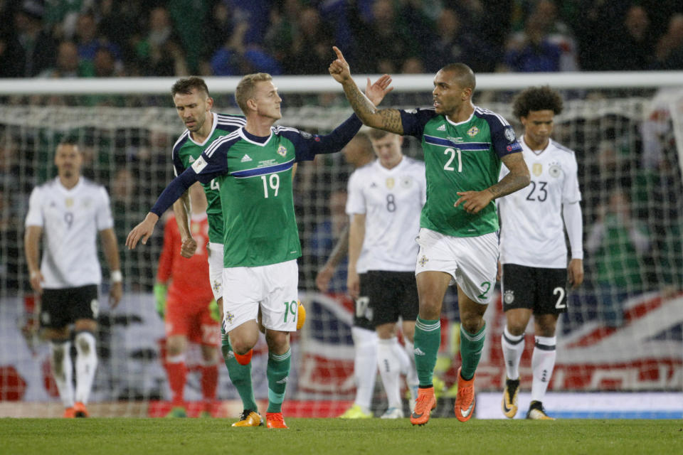 Northern Ireland’s Josh Magennis, 21, celebrates scoring against Germany with George Saville