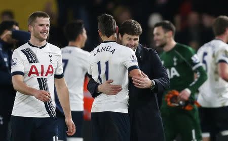 Football Soccer - Watford v Tottenham Hotspur - Barclays Premier League - Vicarage Road - 28/12/15 Tottenham manager Mauricio Pochettino celebrates with Erik Lamela after the game as Eric Dier looks on Action Images via Reuters / Matthew Childs Livepic