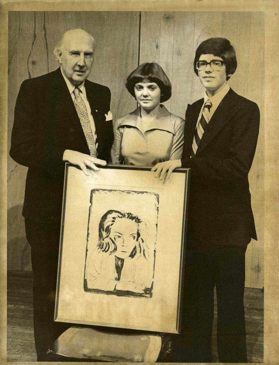 Ferdinand Eckhardt, left, poses with Eckhardt-Gramatté Music Competition winners Desmond Hoebig, right, and Gwen Hoebig, who went on to become concertmaster with the Winnipeg Symphony Orchestra. Taken in 1977, the photo shows the trio with a painting of Sophie-Carmen Eckhardt-Gramatté.