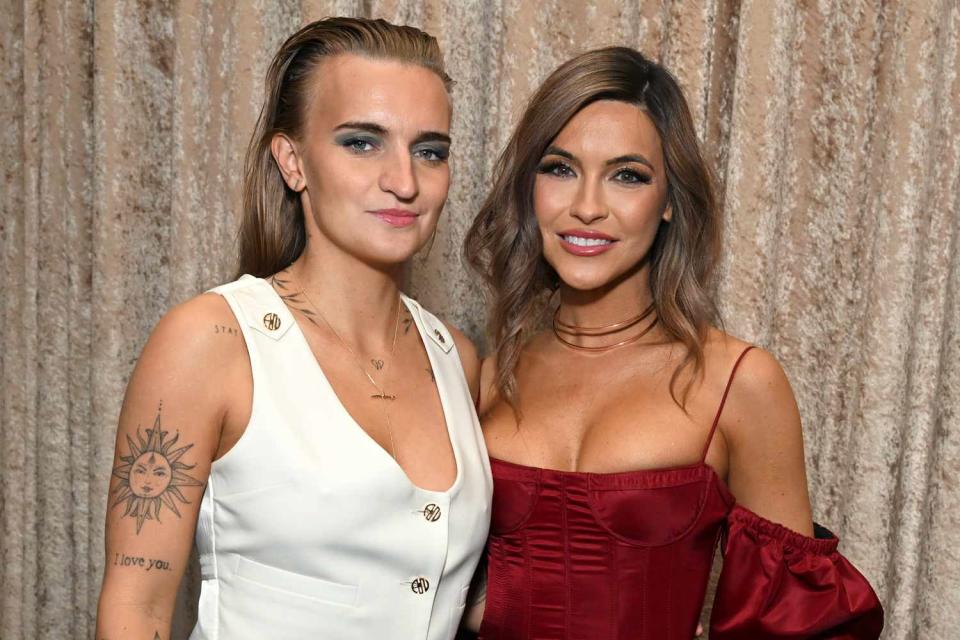 <p>Michael Kovac/Getty</p> G Flip (left) and wife Chrishell Stause (right) at the GLAAD Media Awards in March 2023.