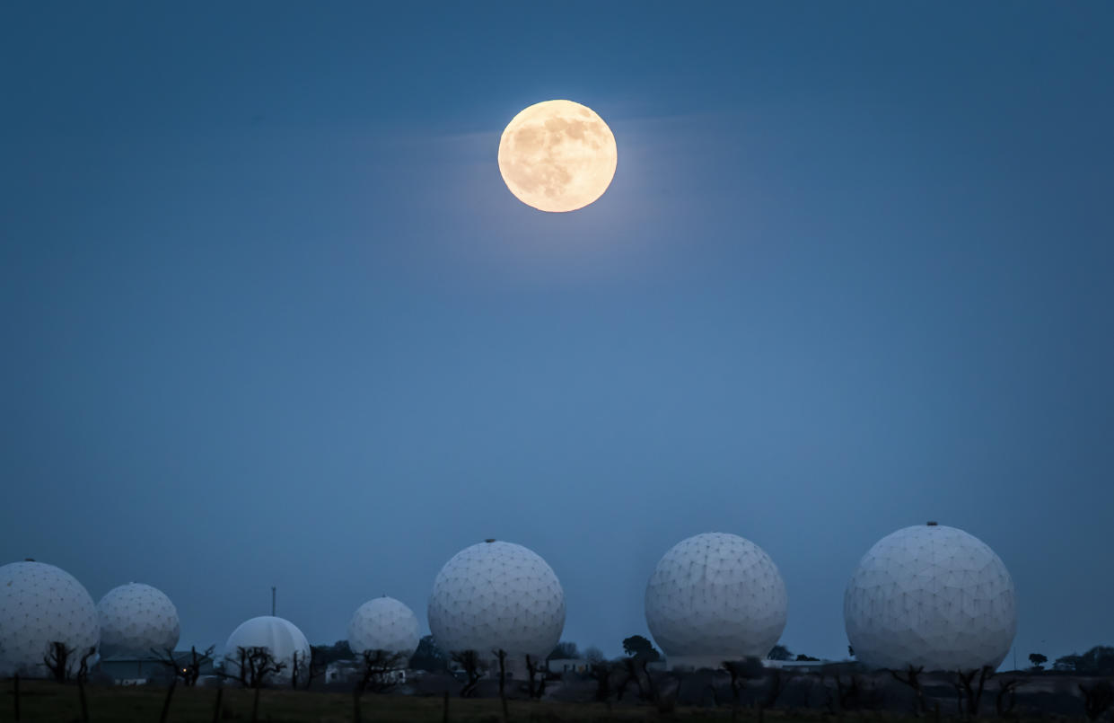 The wolf moon rises above rises above Menwith Hill near Harrogate, North Yorkshire.