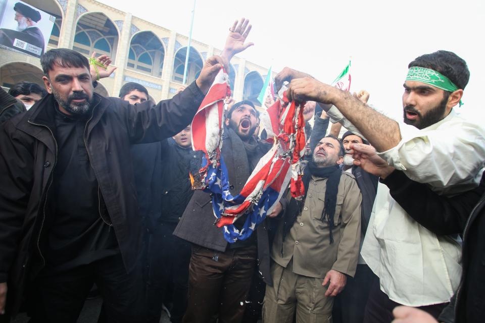Iranians burn an American flag. (Photo: ATTA KENARE via Getty Images)
