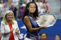 Leylah Fernandez, of Canada, holds up the runner-up trophy after losing to Emma Raducanu, of Britain, during the women's singles final of the US Open tennis championships, Saturday, Sept. 11, 2021, in New York. (AP Photo/Seth Wenig)