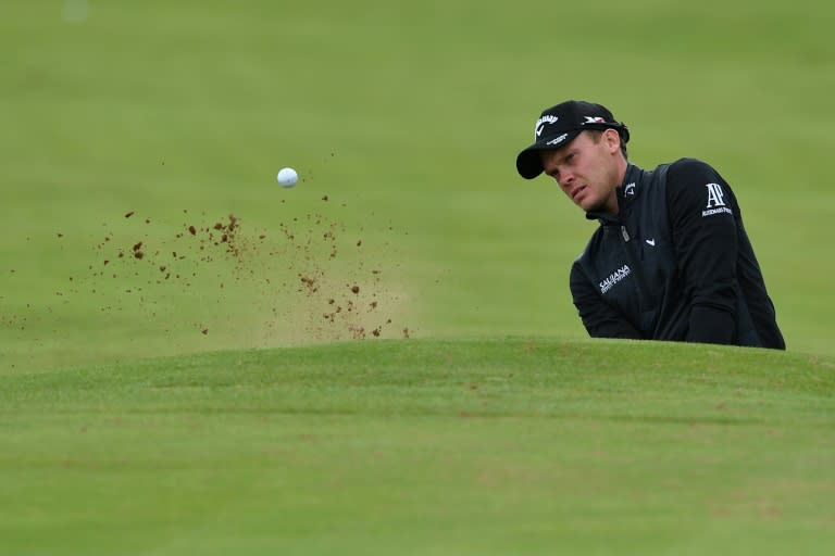 England's Danny Willett plays from a bunker on the 1st hole during practice on July 11, 2016, ahead of the 2016 British Open Golf Championship at Royal Troon in Scotland.The 2016 British Open begins on July 14, 2016