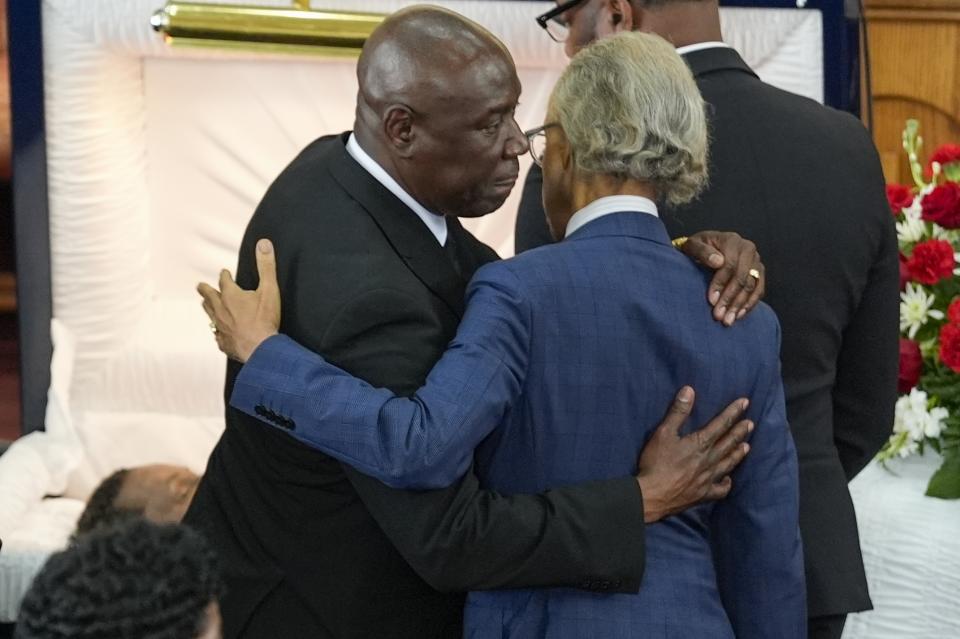 Rev. Al Sharpton, right, hugs attorney Ben Crump at the funeral for D'Vontaye Mitchell Thursday, July 11, 2024, in Milwaukee. Mitchell died June 30. (AP Photo/Morry Gash)