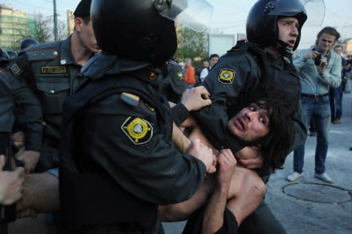 Russian police detain opposition supporters during a rally in Moscow in May 2012. The Russian lower house or State Duma has adopted a controversial bill that would greatly increase fines for protesters