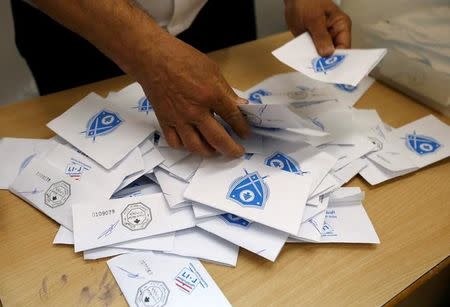 A Lebanese election official counts ballots after the polling station closed during Beirut's municipal elections in Lebanon, May 8, 2016. REUTERS/Mohamed Azakir