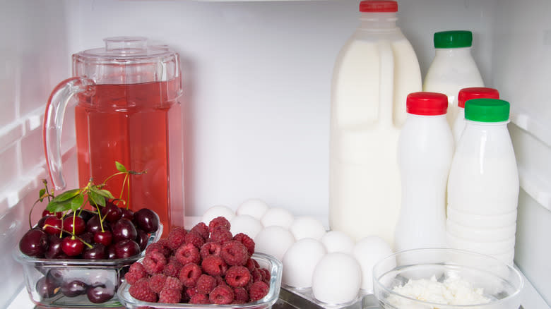 Kefir and produce in refrigerator