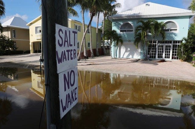 After one of the worst king-tide seasons in memory — coupled by the accelerating pace of sea-level rise — leaders of the Florida Keys, like those across South Florida, are demanding action on climate change. This Key Largo neighborhood has endured flooding for close to three months.