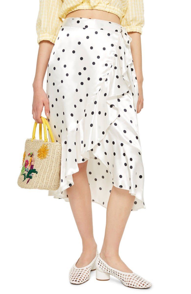 Get it at <a href="https://shop.nordstrom.com/s/topshop-satin-spot-ruffle-skirt/5011020?origin=coordinating-5011020-0-3-PDP_2-recbot-new_arrival_subcategory&amp;recs_placement=PDP_2&amp;recs_strategy=new_arrival_subcategory&amp;recs_source=recbot&amp;recs_page_type=product" target="_blank">Nordstrom</a>, $80.