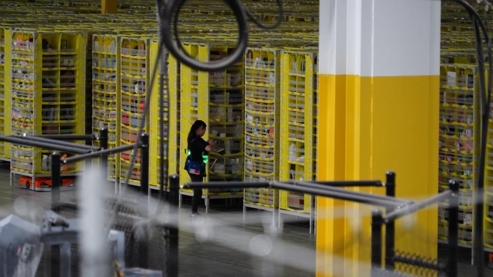 The Amazon fulfillment centre in the Montreal borough of Lachine is largely automated, with about 400 employees helping ship as many as 70,000 products daily.