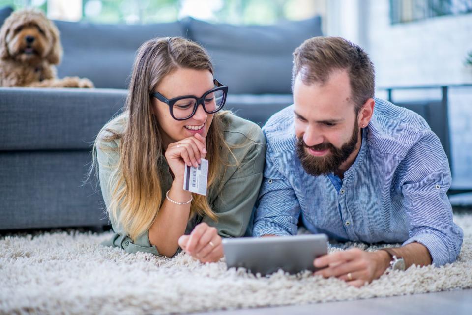 a gen x millennial couple buying something online