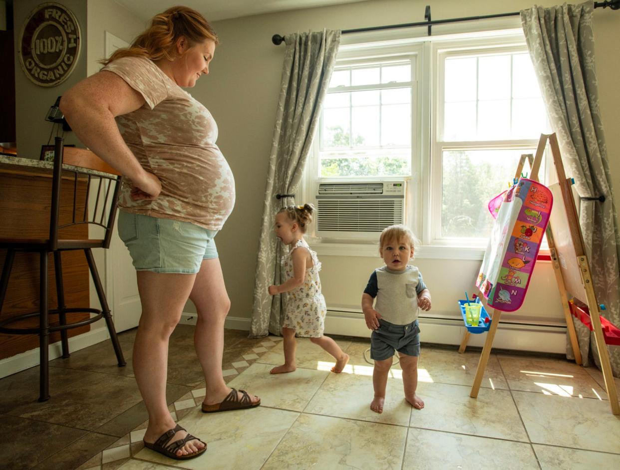 Expectant mother Lauren Colameta and her children Cecilia and Walter Wednesday in their Templeton home.