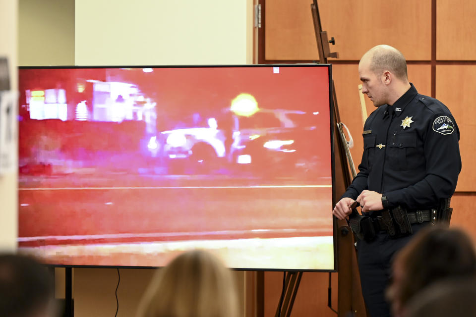 Pierce County Sheriff's Deputy Arron Wolfe describes what is occurring in a video of a 2019 incident involving Manny Ellis during the trial of three Tacoma Police officers in the killing of Manny Ellis at Pierce County Superior Court, Monday, Nov. 13, 2023, in Tacoma, Wash. Tacoma Police Officers Christopher Burbank, Matthew Collins and Timothy Rankine stand trial for charges related to the March 2020 killing of Manny Ellis. (Brian Hayes/The News Tribune via AP, Pool)