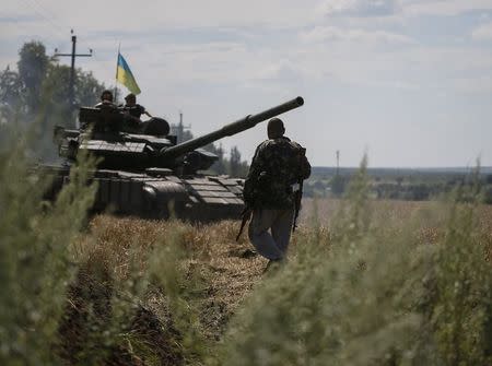 A Ukrainian tank is seen at a position near the eastern Ukrainian city of Konstantinovka July 10, 2014. REUTERS/Gleb Garanich