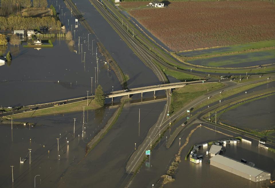 An overpass is pictured going over a flooded Highway 1 near Chilliwack, B.C., in the aftermath of massive floods in 2021. THE CANADIAN PRESS/Jonathan Hayward