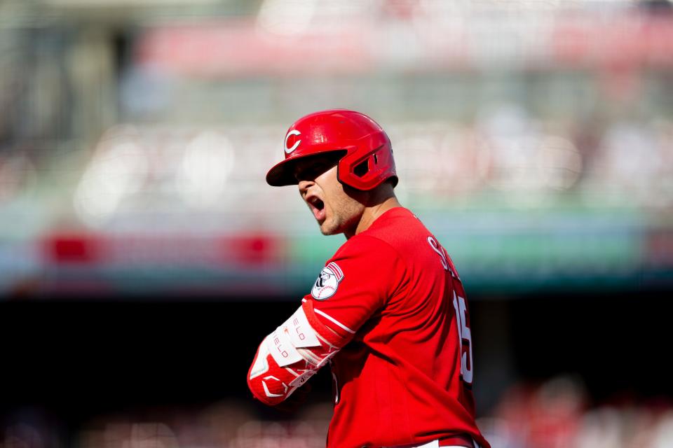 Cincinnati Reds center fielder Nick Senzel (15) yells back at the reds dugout after hitting an RBI base hit in the fifth inning of the MLB game between the Cincinnati Reds and the Atlanta Braves at Great American Ball Park in Cincinnati on Saturday, July 2, 2022.