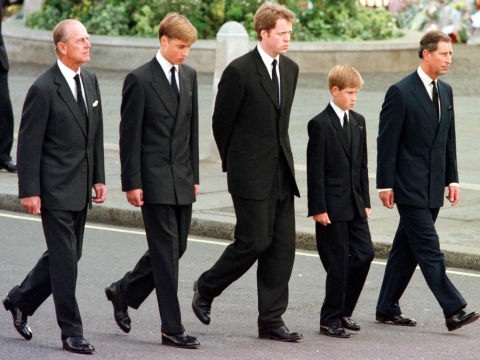 The Duke of Edinburgh, Prince William, Earl Spencer, Prince Harry and Prince Charles walk outside Westminster Abbey during the funeral service for Diana, Princess of Wales.