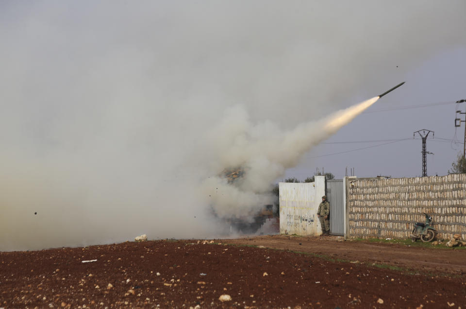 Turkish soldiers fire a missile at Syrian government position in the province of Idlib, Syria, Friday, Feb. 14, 2020. Turkey, backer of Syria's opposition, has been deploying equipment and troops in the region, which is home to more than 3 million people, in an attempt to halt the Syrian military's advances. (AP Photo/Ghaith Alsayed)