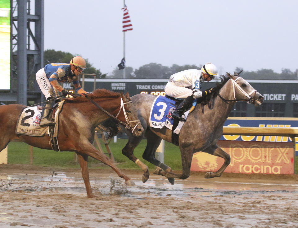 In this image provided by Equi-Photo, Saudi Crown, right, ridden by Florent Geroux, wins the Pennsylvania Derby horse race, Saturday, Sept. 23, 2023, at Parx Racing in Bensalem, Pa. (Bill Denver/Equi-Photo via AP)