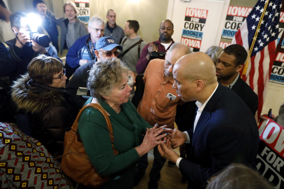 2020 Democratic presidential candidate Sen. Cory Booker talks with an audience member during a meeting with local residents, Saturday, March 16, 2019, in Ottumwa, Iowa. (AP Photo/Charlie Neibergall)