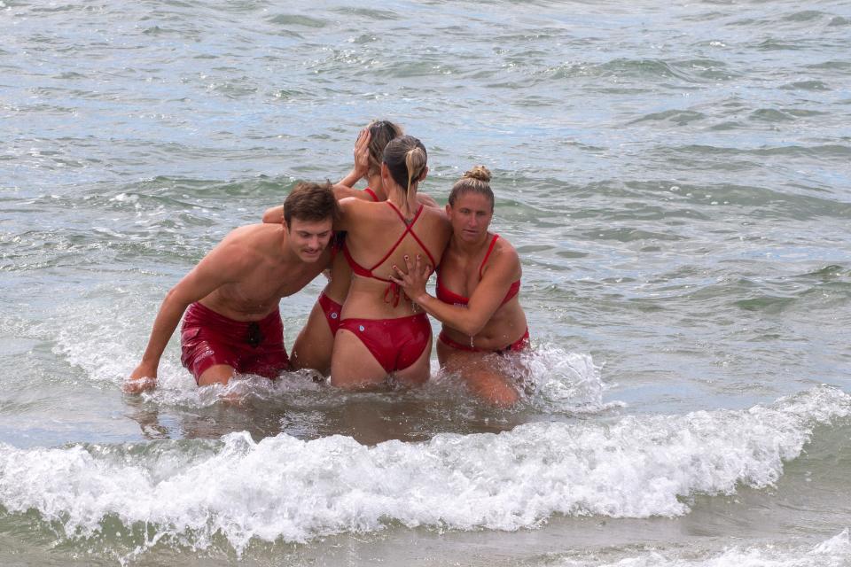 Brick Beach Ocean Rescue lifeguards train to stabilize a victim's neck during a rescue in the morning at Brick Beach III in Brick Township, NJ Thursday, June 23, 2022. 