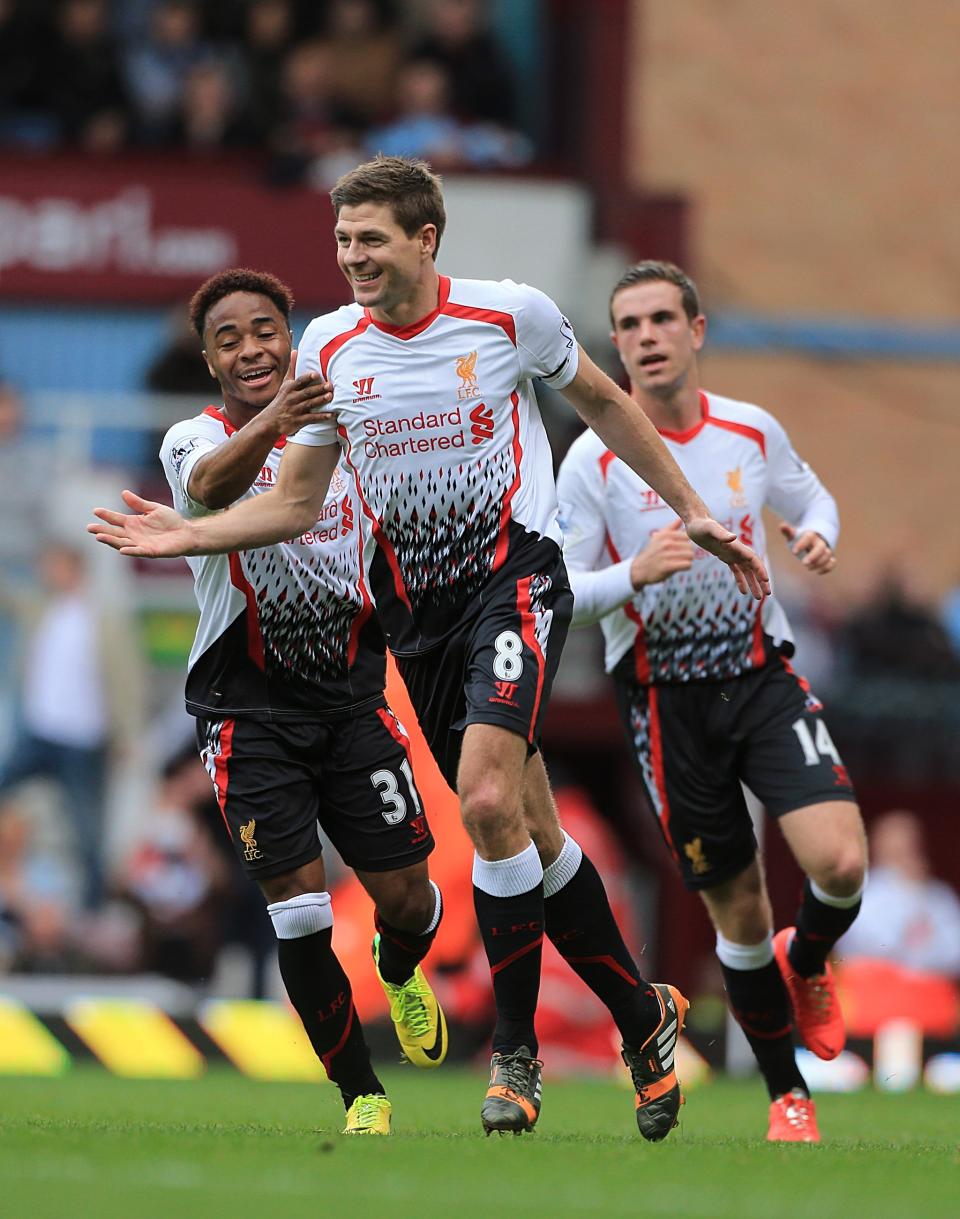 Liverpool's Steven Gerrard (centre) celebrates after scoring his team's opening goal during their English Premier League match against West Ham at Upton Park, London, Sunday, April 6, 2014. (AP Photo / Nick Potts,PA) UNITED KINGDOM OUT NO SALES NO ARCHIVE