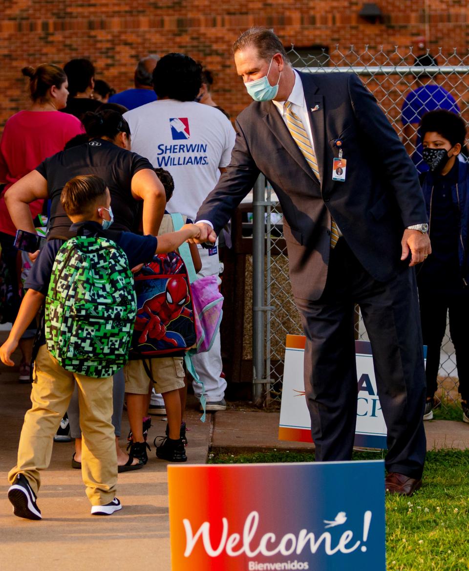 Oklahoma City Public School superintendent Dr. Sean McDaniel gives fist bumps to students as they arrive at Rockwood Elementary for Oklahoma City Public SchoolÕs first day of class  on Monday, Aug. 9, 2021, in Oklahoma City, Okla. 