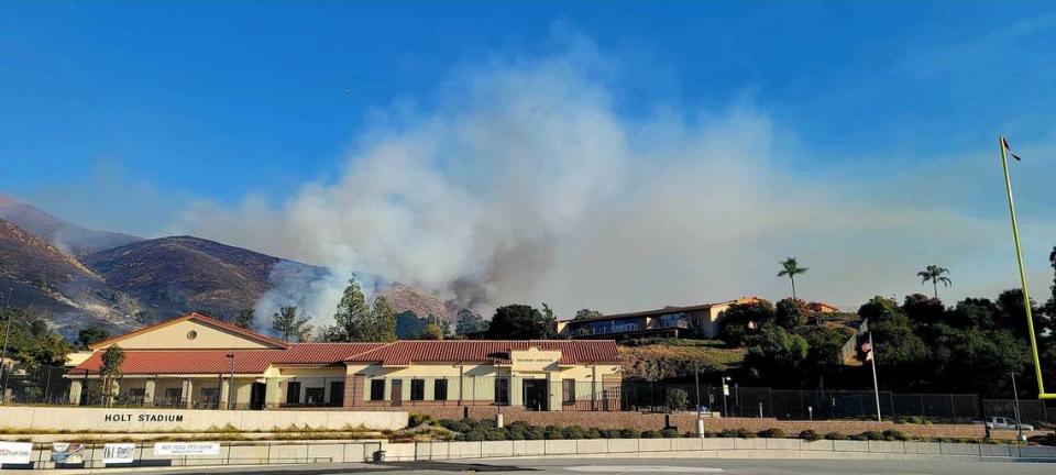 A fire burns the hillside behind off Lizzie Street behind San Luis Obispo High School on Monday, Oct. 30, 2023.
