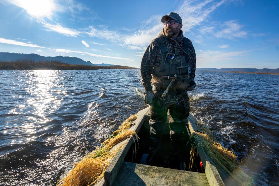 Scott McFarren returns to shore after duck hunting Tuesday, November 21, 2023 in the Upper Mississippi River National Wildlife and Fish Refuge in Stoddard, Wisconsin. Established in 1924, the refuge stretches 261 river miles from Wabasha, Minnesota to Rock Island, Illinois. It is a haven for migratory birds, fish, wildlife and protects more than 240,000 acres of Mississippi River floodplain. McFarren is a youth and education coordinator for Ducks Unlimited.