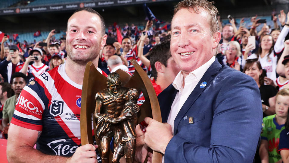 Pictured here, Roosters captain Boyd Cordner and coach Trent Robinson holding the 2019 NRL grand final trophy.