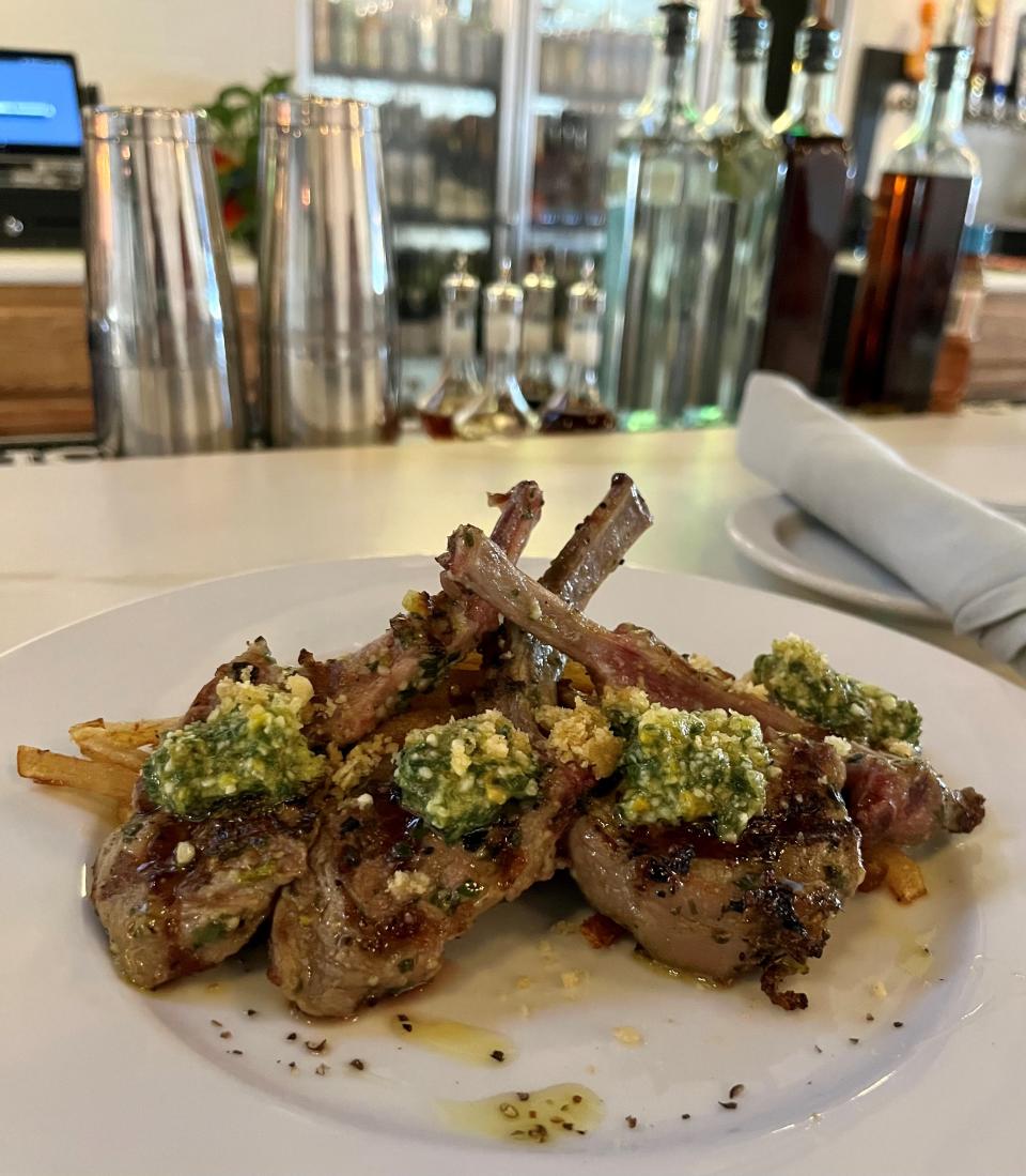 The grilled lamb chops with pistachio pesto are served with Yukon fries at Sage on 47th.