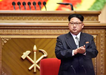 North Korean leader Kim Jong Un claps during the first congress of the country's ruling Workers' Party in 36 years, in Pyongyang, North Korea, in this photo taken by Kyodo May 9, 2016. Kyodo/via REUTERS